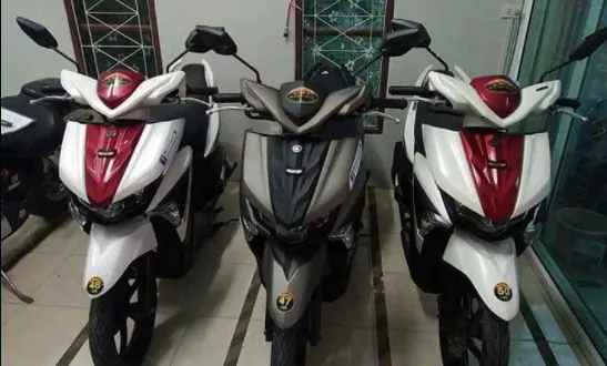 Three motorbikes displayed for rent at Hua Hin Moto rental shop