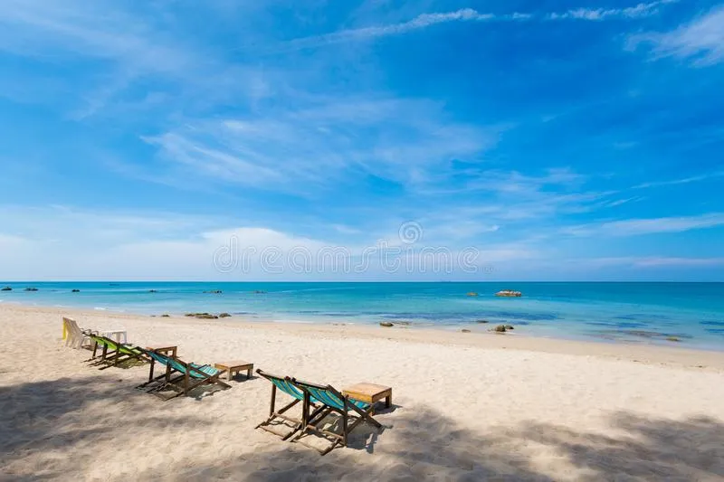 The white sand beach with sun lounger chairs in Klong Nin Beach, Koh Lanta
