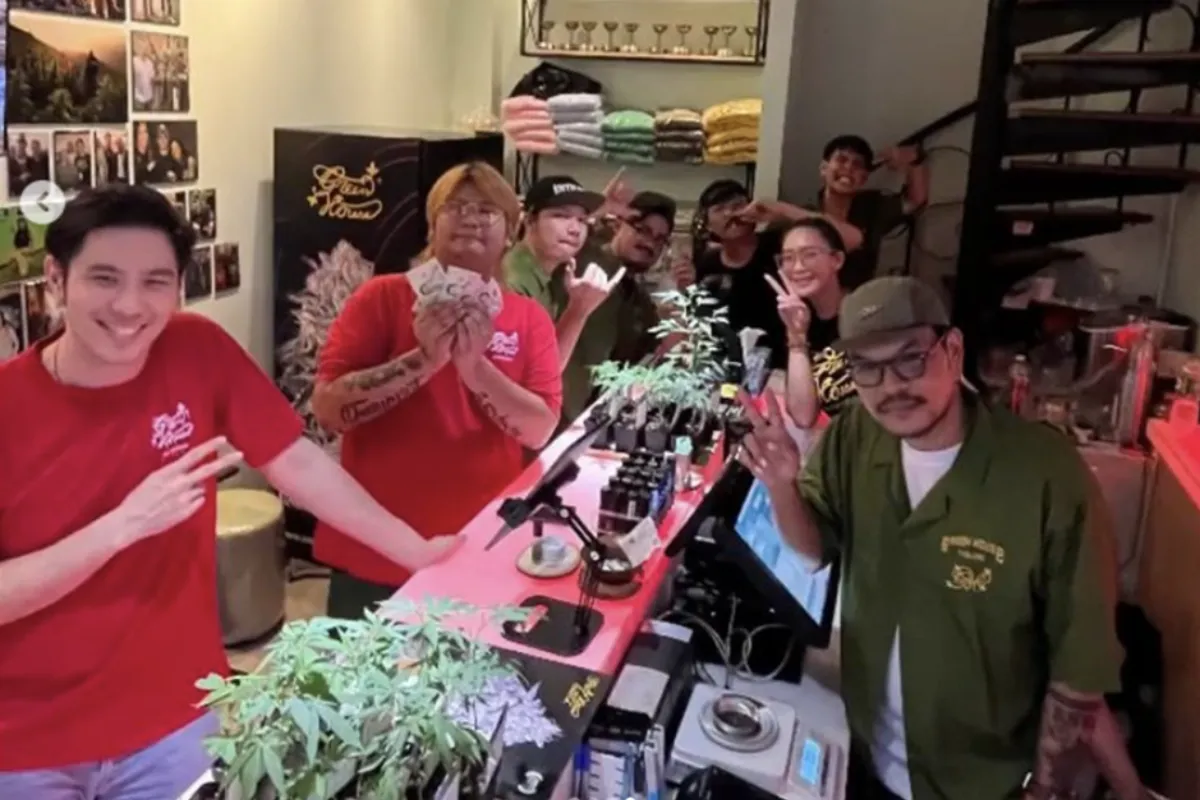 A group of people hanging out inside Green House Thailand Cannabis Dispensary in Bangkok