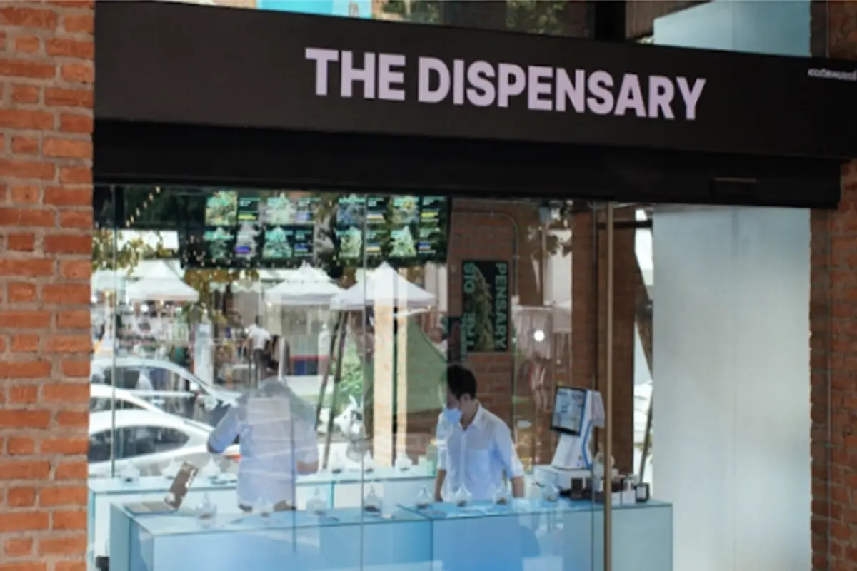 It shows the clear glass storefront of The Dispensary Nimman Chiang Mai’s shop.