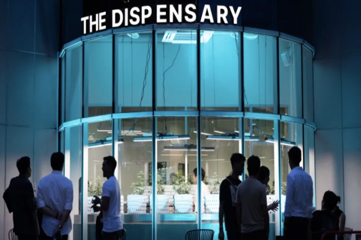 Several men hanging outside the Dispensary by Taratera shop in their Sukhumvit Bangkok branch