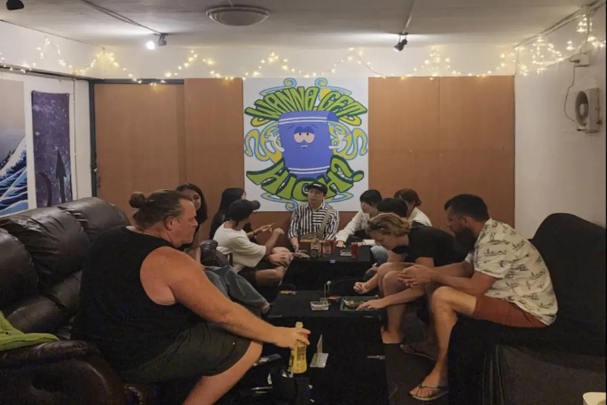 A group of people enjoying their weed and beers inside Green Ganesha Wellness Center’s smoking lounge