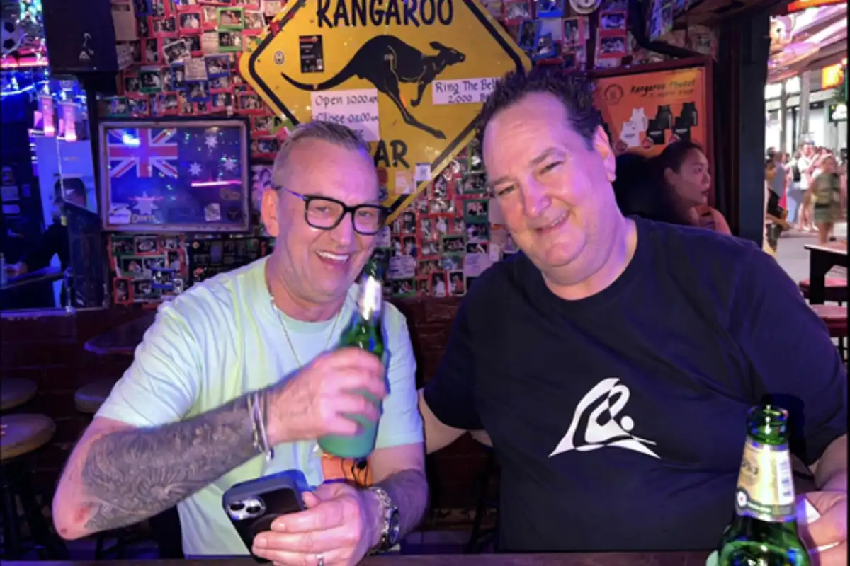 Two men drinking beer inside the Kangaroo Bar in Phuket