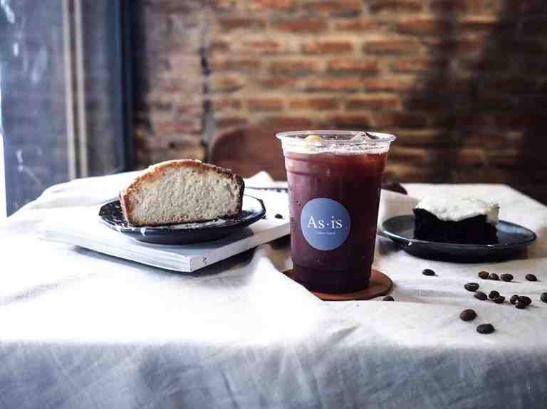 A closeup photo of the iced coffee and pastries served at As.Is Coffee Shop in Bangkok