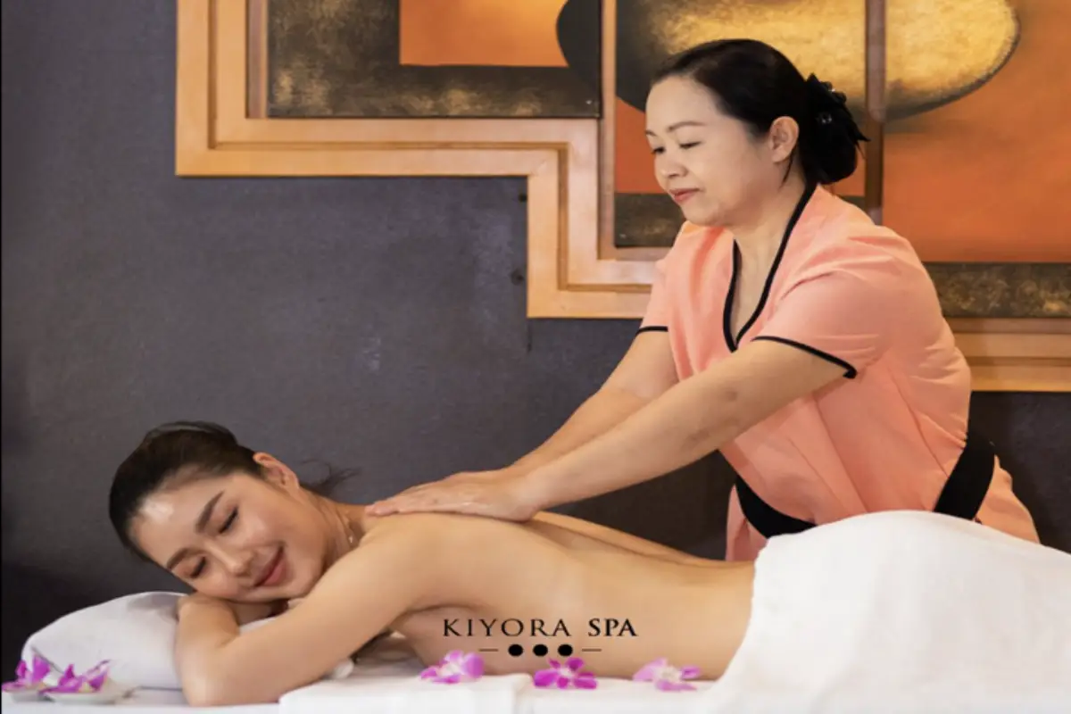 A female therapist is performing an aromatherapy massage on a woman at Kiyora Spa in Chiang Mai