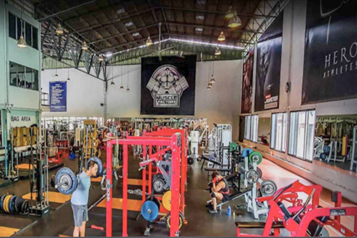 It showcases the different weightlifting equipment at Muscle Factory in Bangkok
