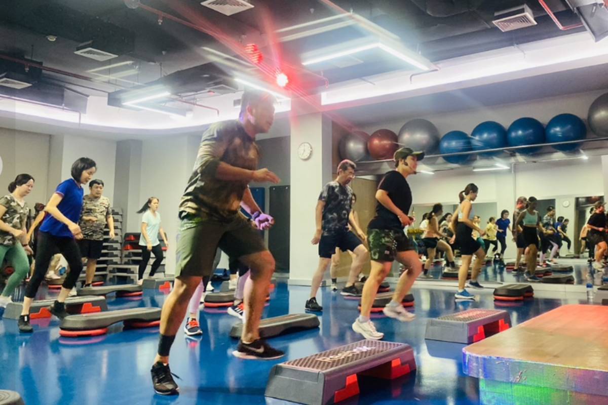 A group step boxing class inside the O2 Fitness Gym in Bangkok