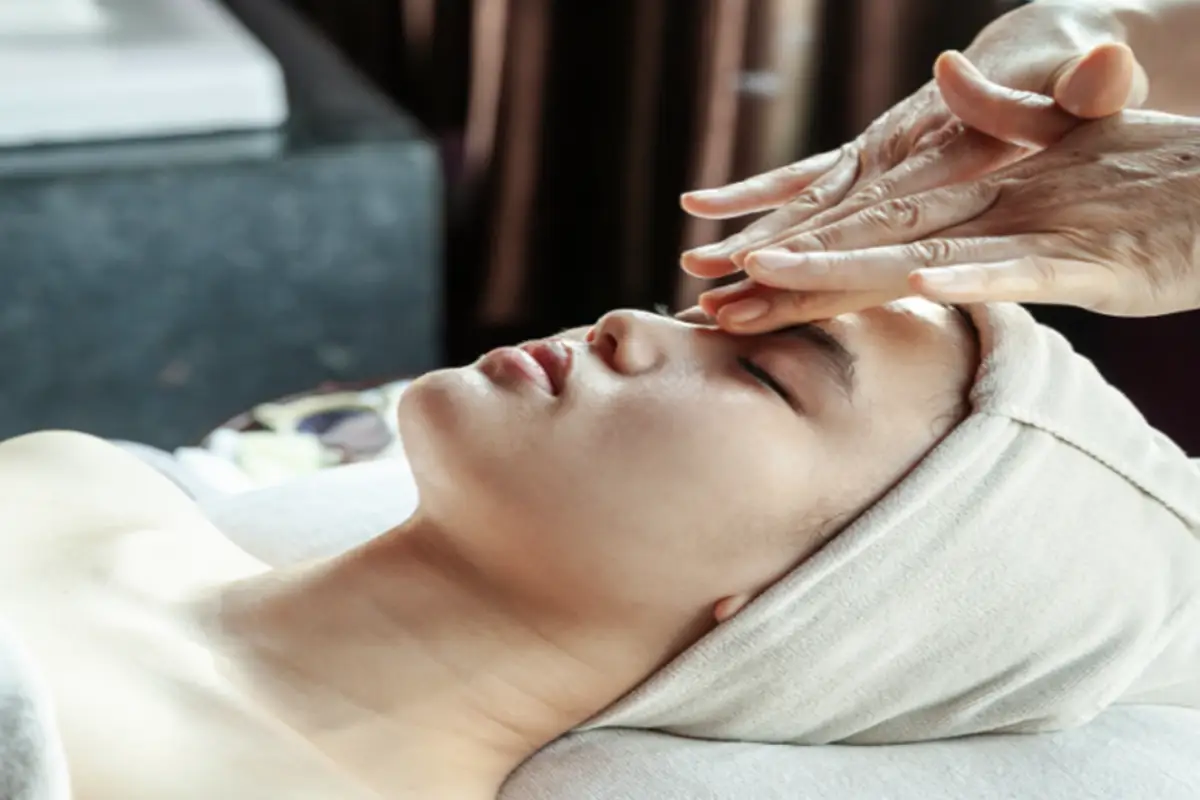 A woman getting a facial massage treatment at Zira Spa in Chiang Mai
