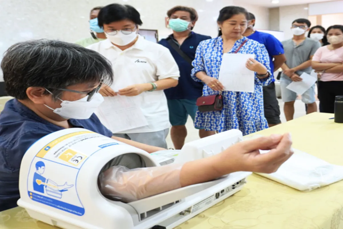 A man’s arm is attached to a machine for blood extraction at Bangkok Hospital Pattaya.