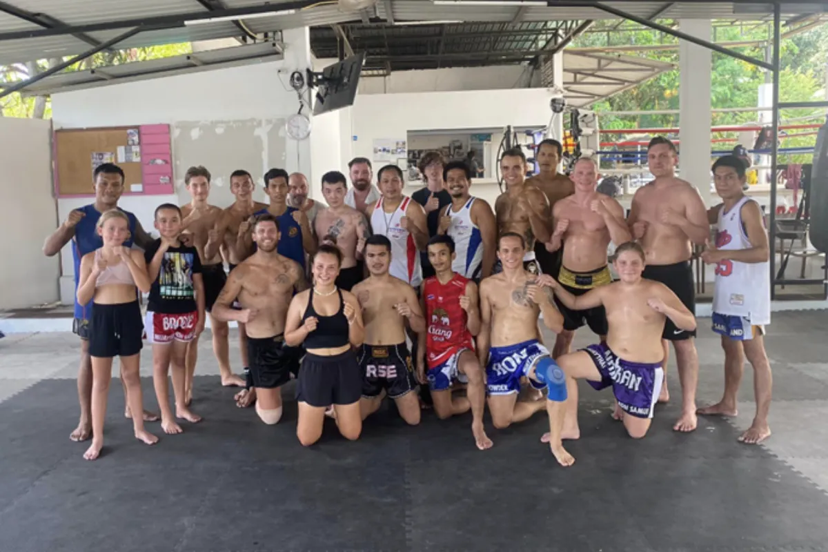 A group of men, women, and children training at Downden Muay Thai in Koh Samui