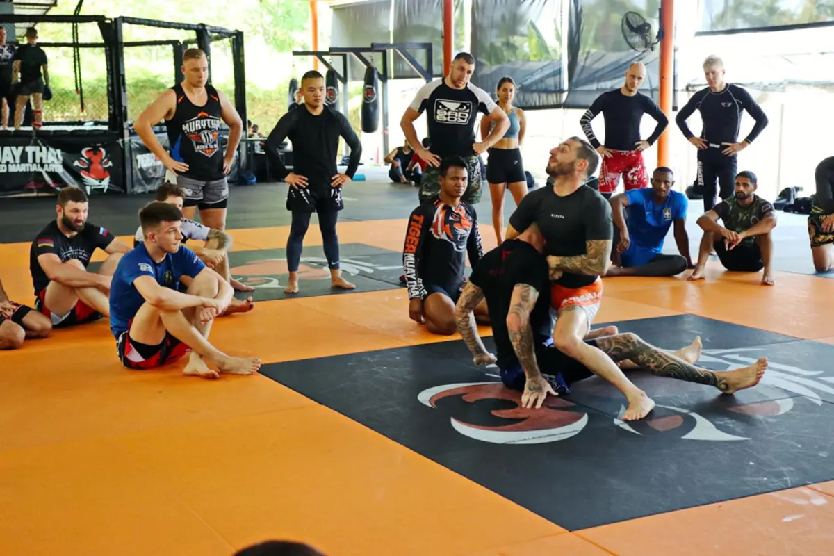 Muay Thai students observing a demonstration inside the Tiger Muay Thai and MMA Training Camp.