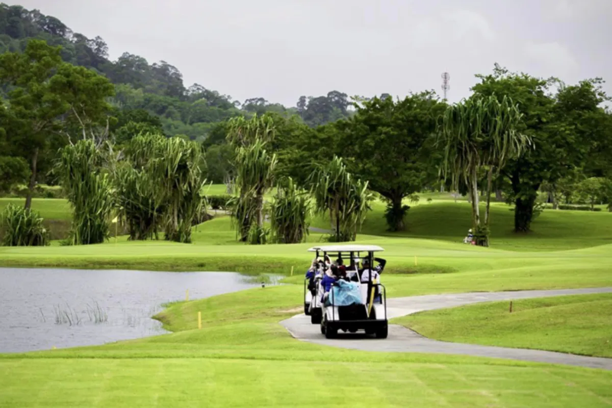 A woman playing golf at the Lake Course of Blue Canyon Country Club in Phuket.