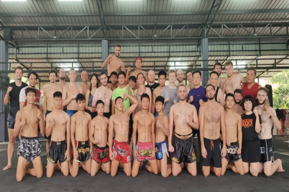 A group of male trainees lined up at Lanna Muay Thai Gym in Chiang Mai