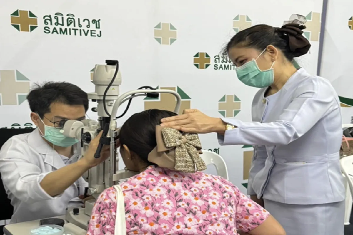 An opthalmologist is checking the eye of a female patient at Samitivej Sriracha Hospital in Pattaya.