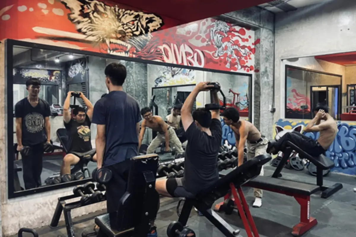 A group of men are exercising inside the Combo4Fitness Gym in Chiang Rai