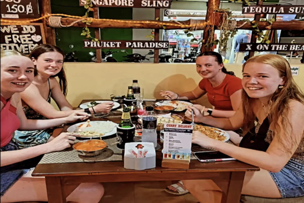 Four women dining at the Curry Delight Restaurant in Phuket
