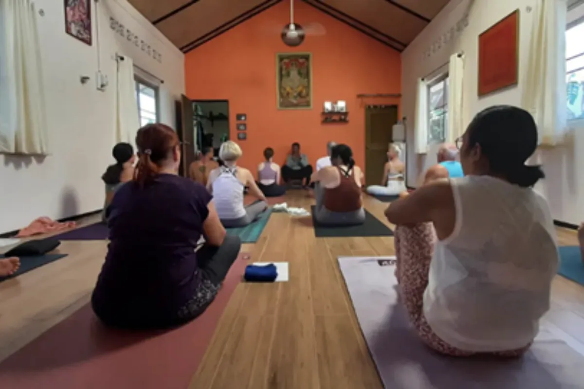 A group of students sitting on their mat during a yoga class at Ganesha Yoga Shala in Phuket.