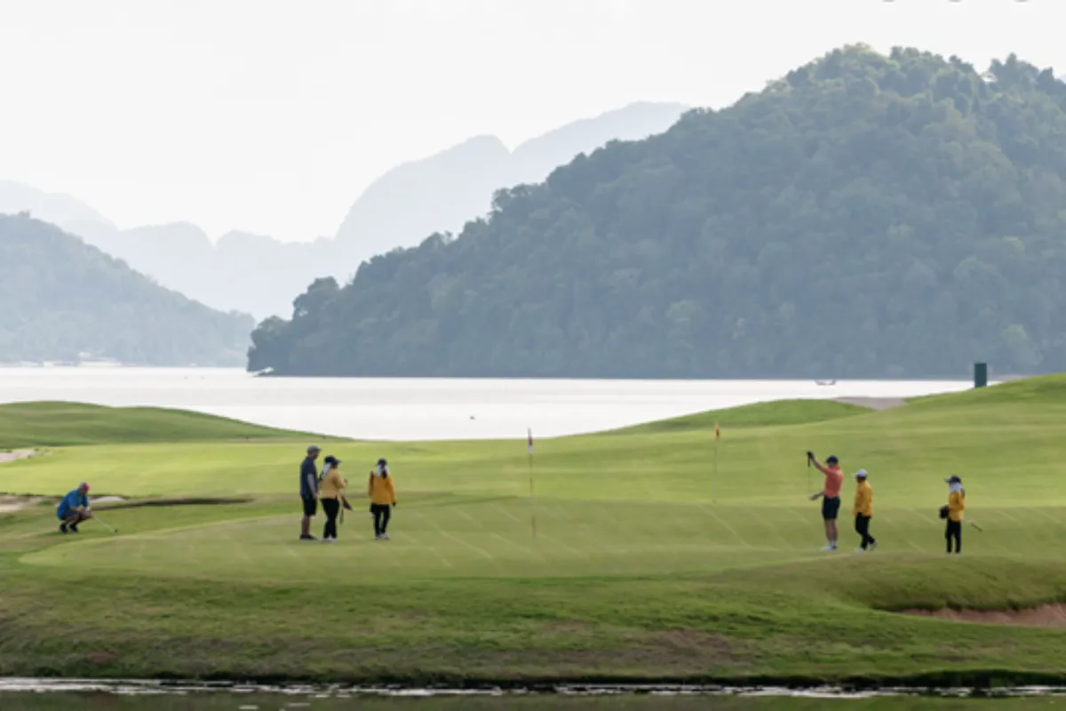 A group of golfers playing at the Mission Hills Phuket Golf Club Resort and Spa in Phuket.