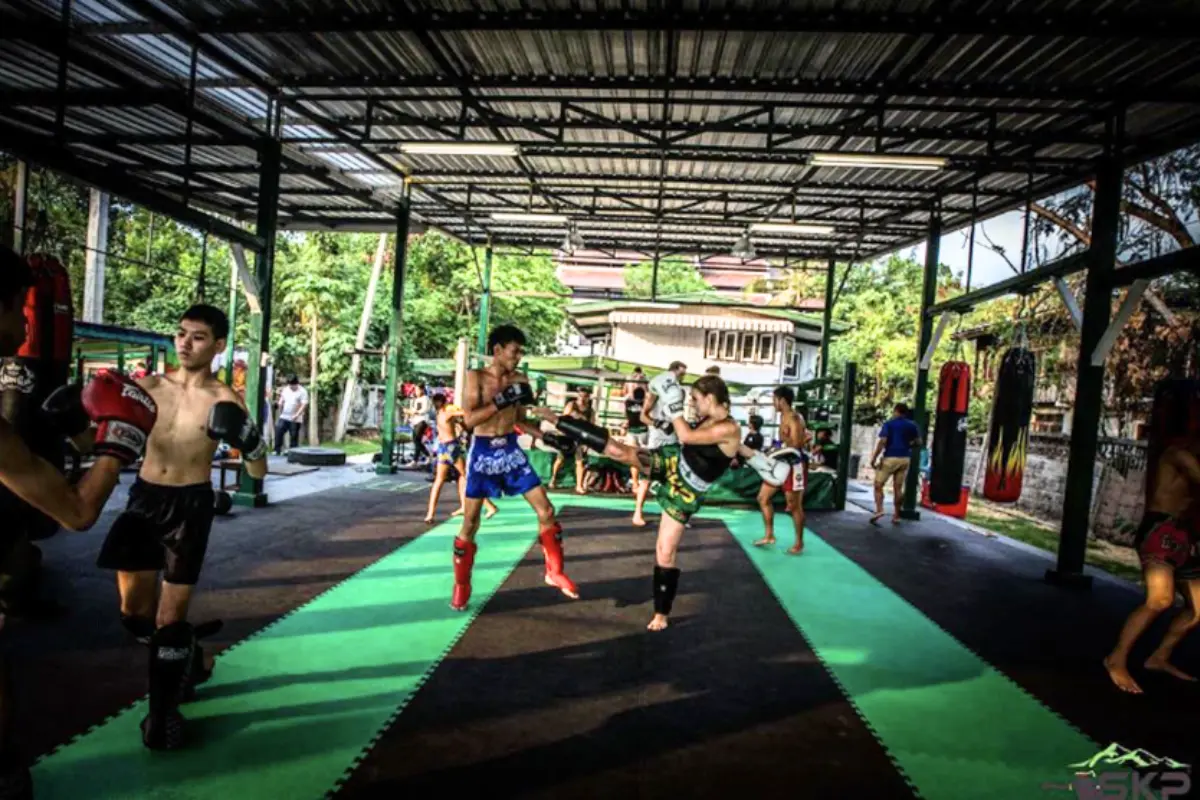 Numerous pairs of trainees sparring with each other at SKP Muay Thai Gym in Chiang Mai

