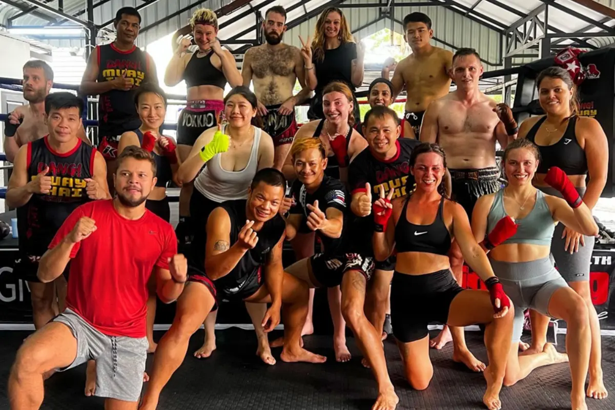 A group of trainees posing after a power-pack session at Dang Muay Thai Chiang Mai