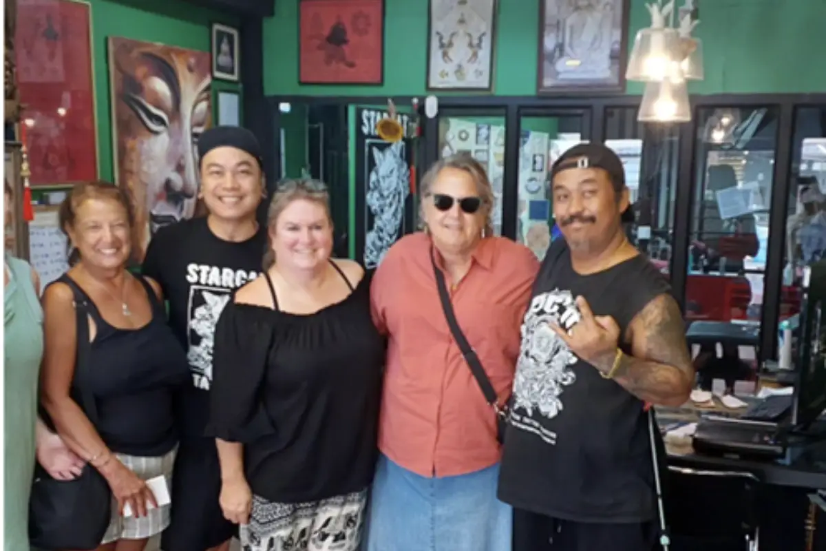 Four happy customers of Starcat Tattoo studio in Koh Samui