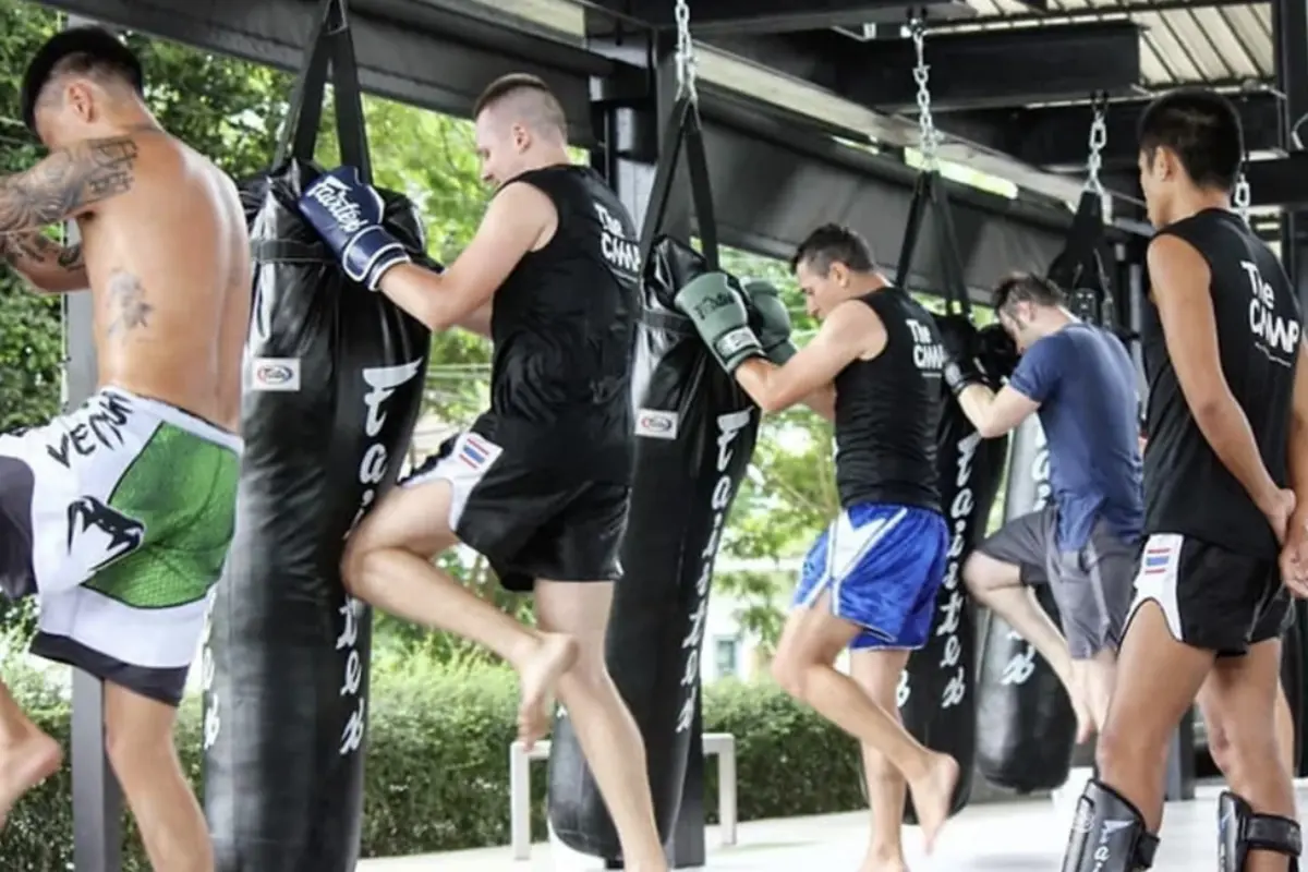 A group of men training Muay Thai at The Camp Muay Thai Resort and Academy in Chiang Mai