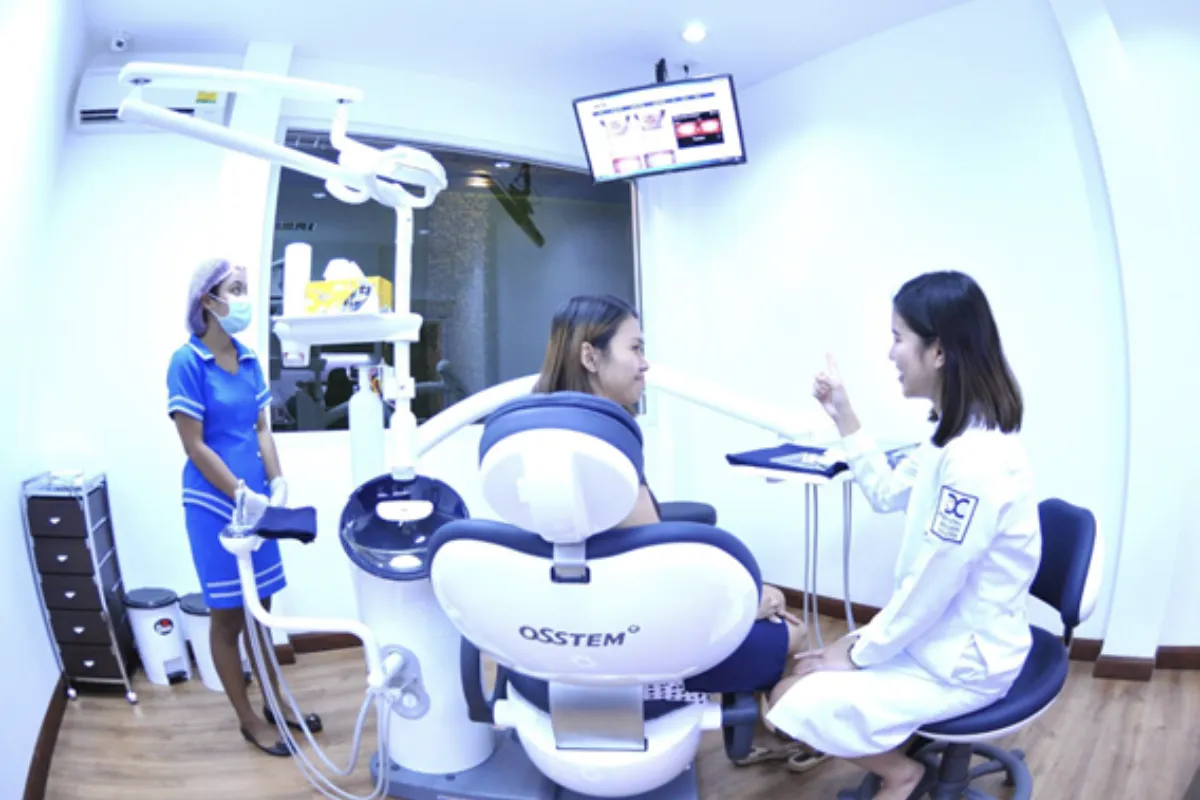 A woman is getting a consultation at the Dental Design Center in Pattaya