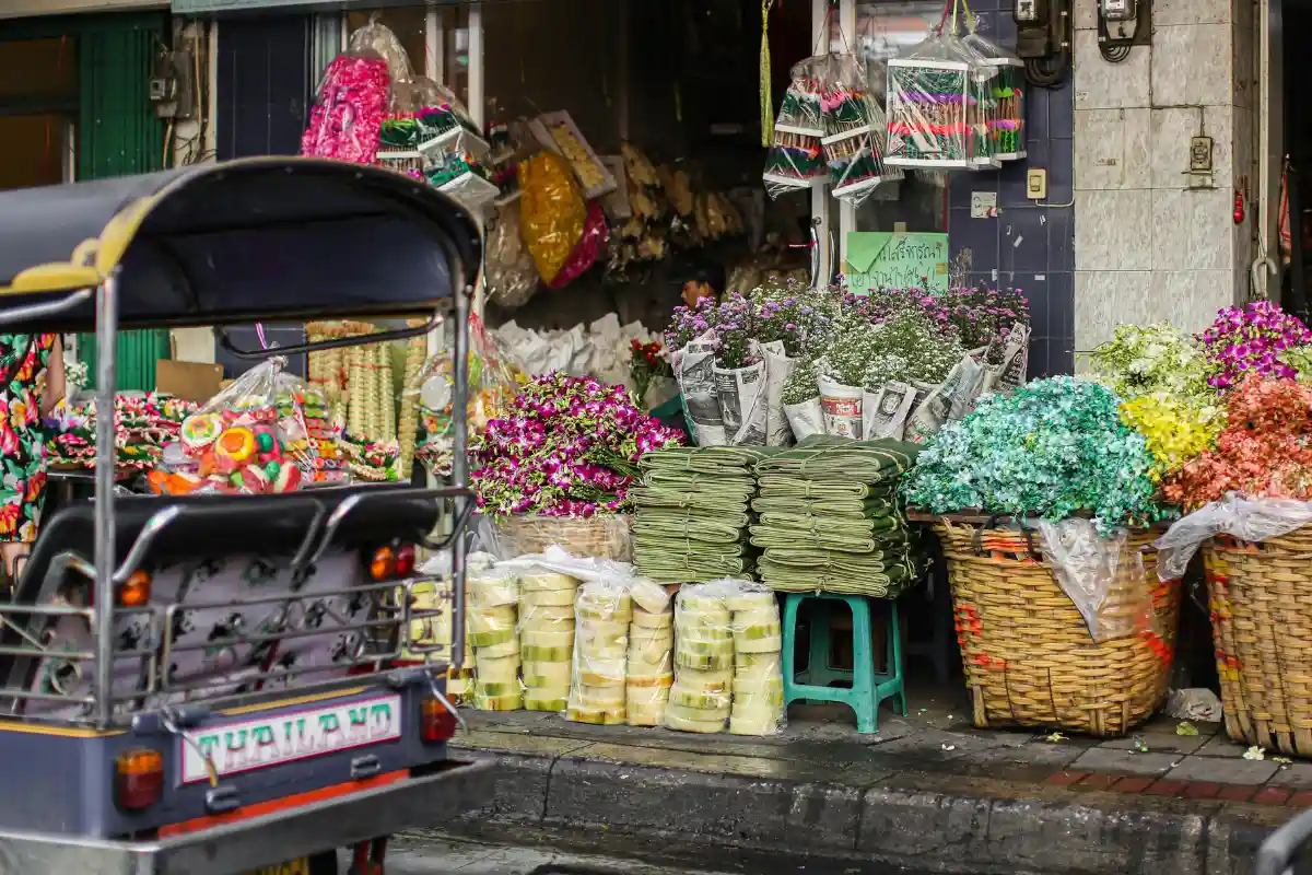 A store selling various flowers and garlands at the Florist Market in Chiang Mai