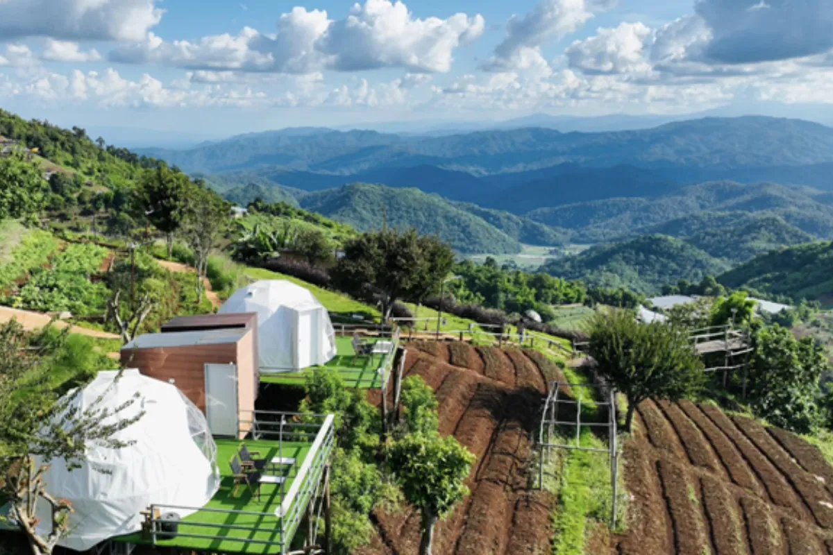 An overview of the dome tents and surrounding mountains at the Nuea Doi Camping site in Chiang Mai 