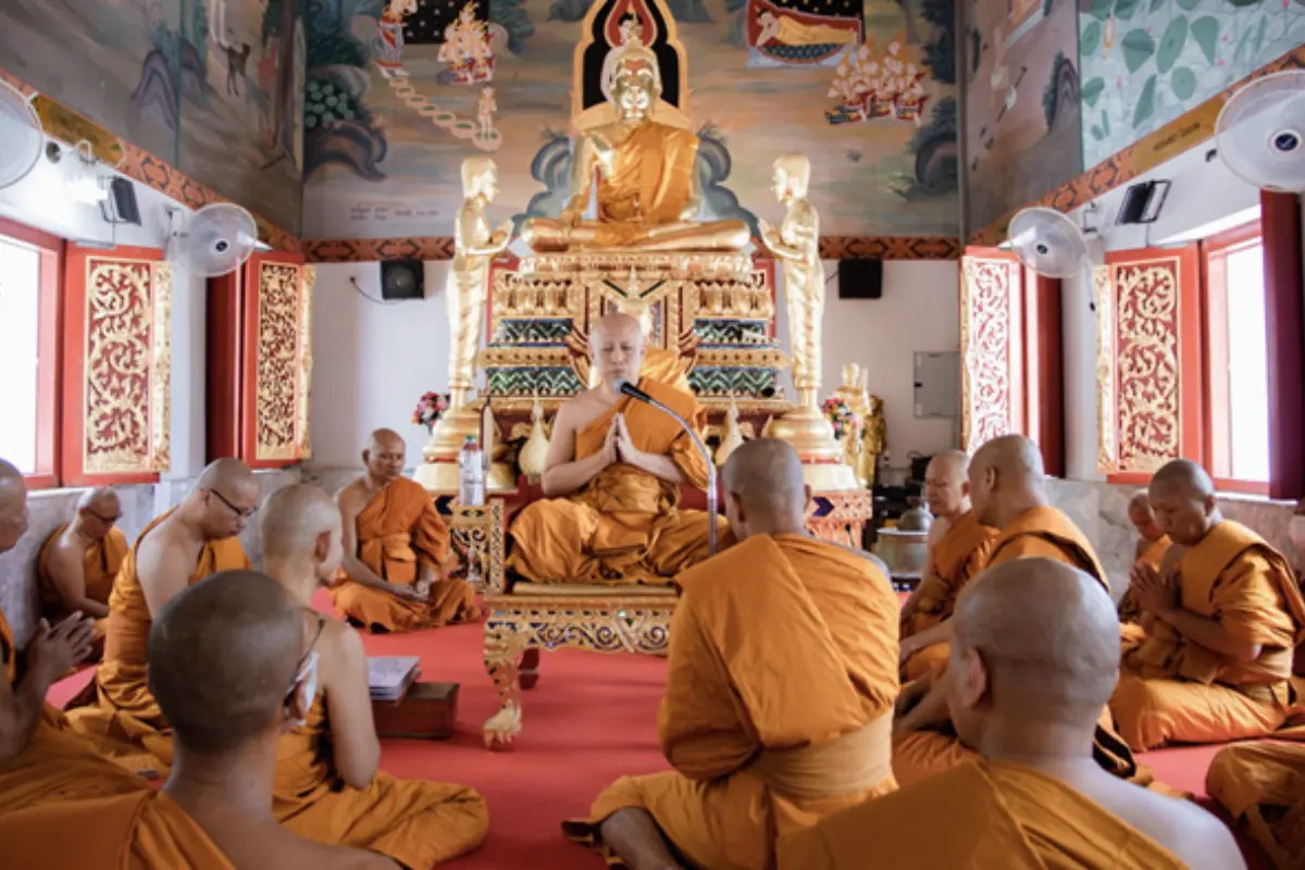 A view inside the Wat Chai Mongkhon where monks are praying
