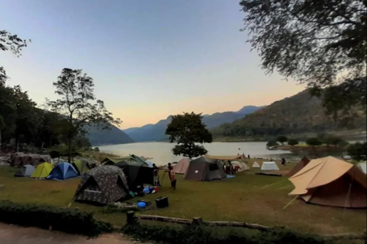 Numerous camping tents spread across the Mae Ping National Park in Chiang Mai