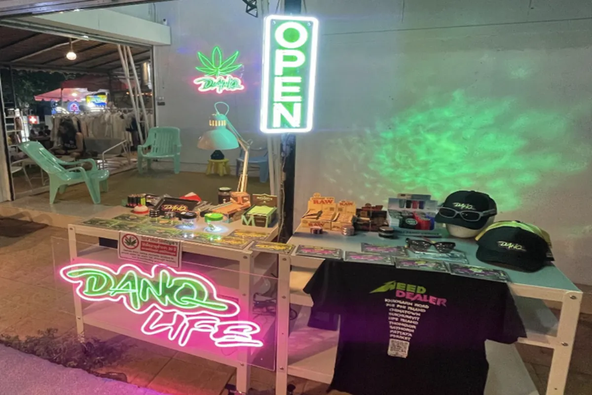 An outdoor display of various weed products and merchandise at Danq Cannabis Dispensary in Koh Lipe