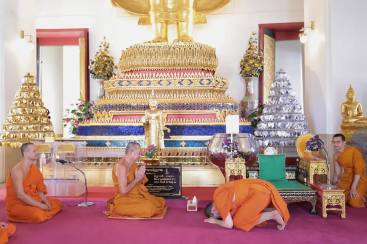 The monks are praying and having a ceremony inside Wat Saket in Bangkok